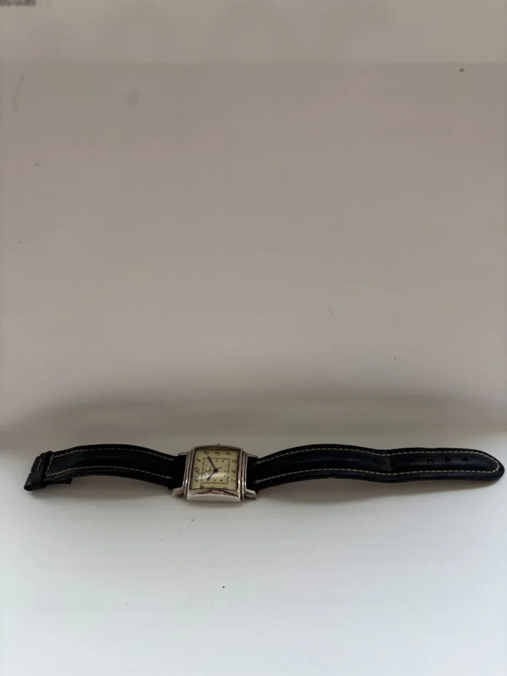 Vintage Fossil watch in Art Deco style with silver bezel and square face